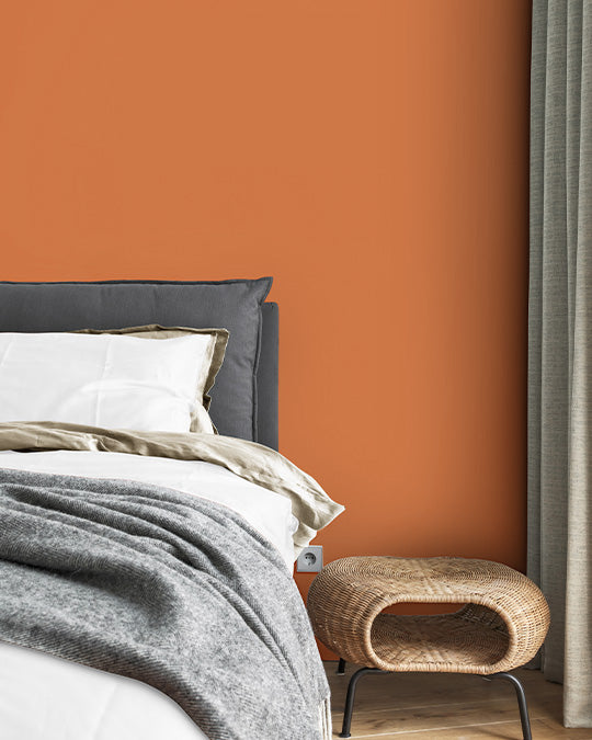 Schlafzimmer im warmen, kräftigen Orange Farbton Papaya