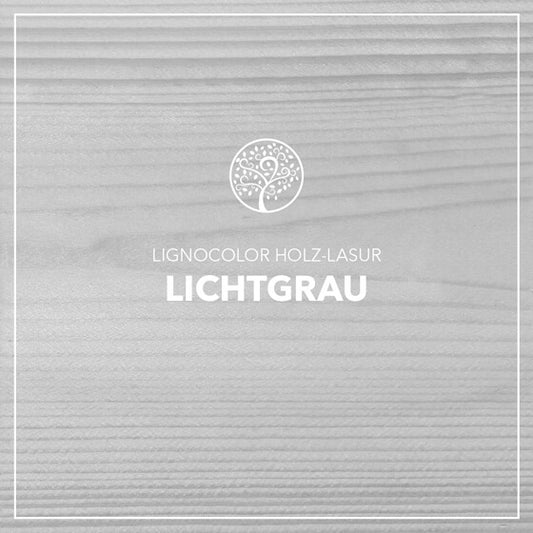 Holzlasur Lichtgrau gestrichen auf einem Holzbrett.